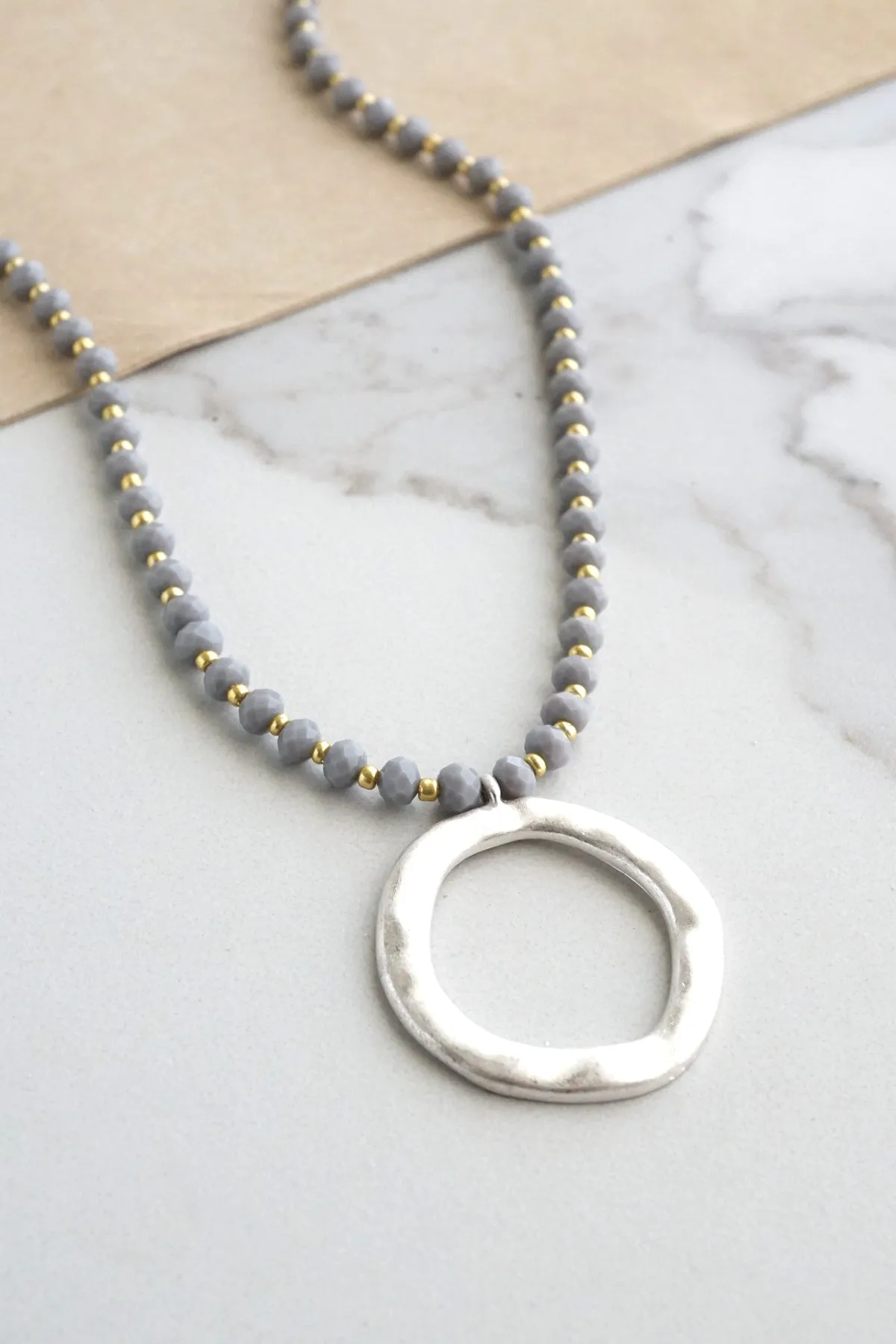 Beaded Necklace with Silver Tone Circle Pendant